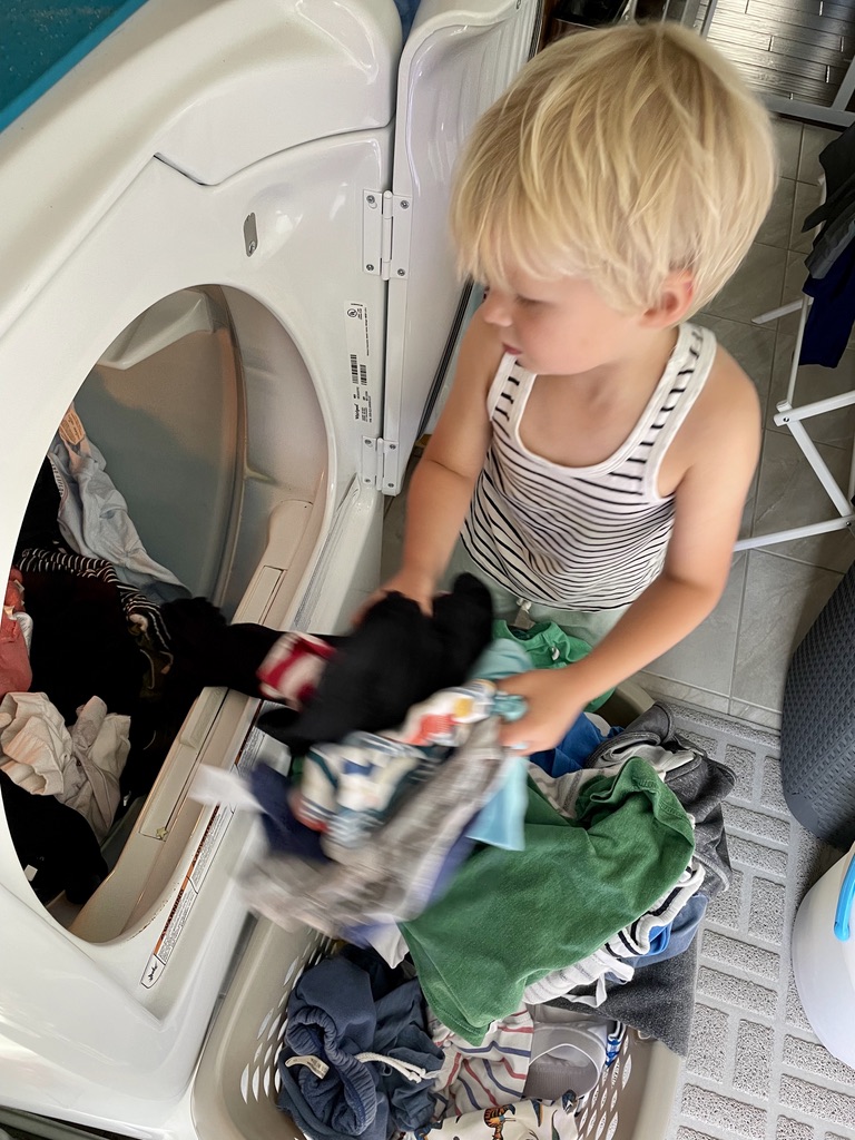 September Intentions blog post | www.yourstrulyelizab.com | photo of boy doing laundry by Eliza B.